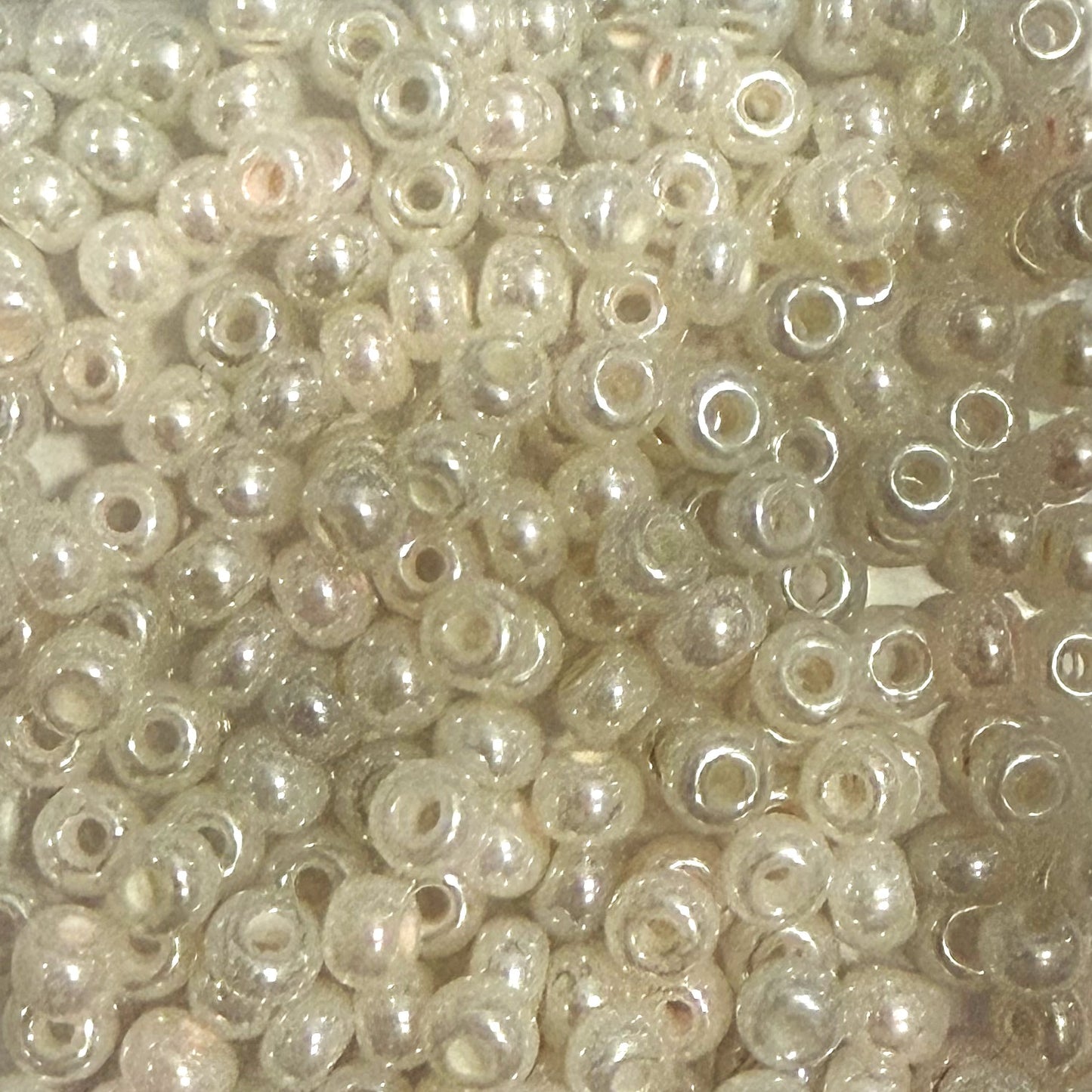 Close-up of small pearl-like beads.